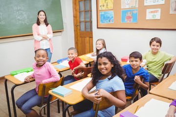 Students and teacher looking at the camera
