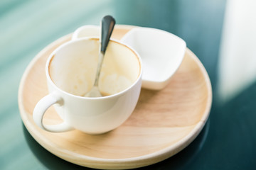 Empty cup of coffee on wooden table ( Filtered image processed v