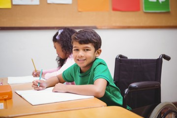 Smiling student sitting in wheelchair