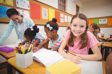 Pupils working at their desks in class
