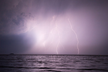 Spectacular lightnings striking the surface of sea