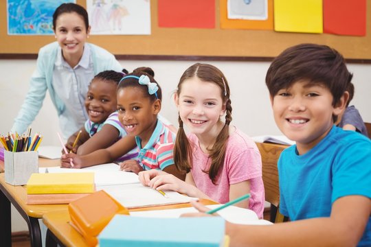 Pupils working at their desks in class