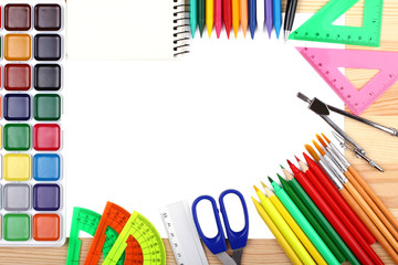 stationery on wooden background