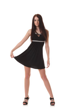 young woman posing in little black dress