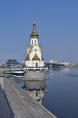 Fototapeta na wymiar Church of Saint Nicholas on the water in Kiev, Ukraine
