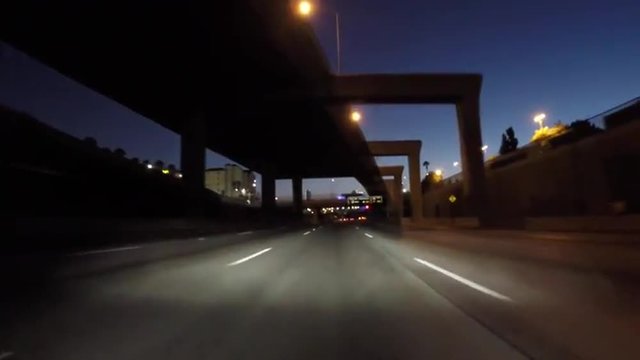 Los Angeles night driving on double deck portion the 110 Harbor Freeway south of downtown.