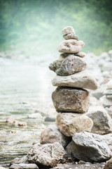 Stack of zen stones on nature background, concept of balance and harmony