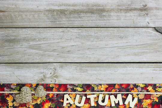 Blank rustic sign with AUTUMN and hearts border