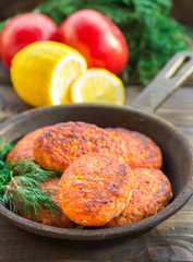 salmon fishcakes in a cast iron skillet