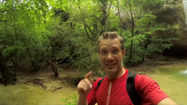Man Making Selfie Video At Waterfall