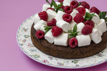 Oatmeal cake with marshmallow and raspberry      