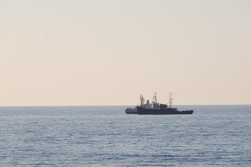 Panorama of a sea with the small ship at a distance