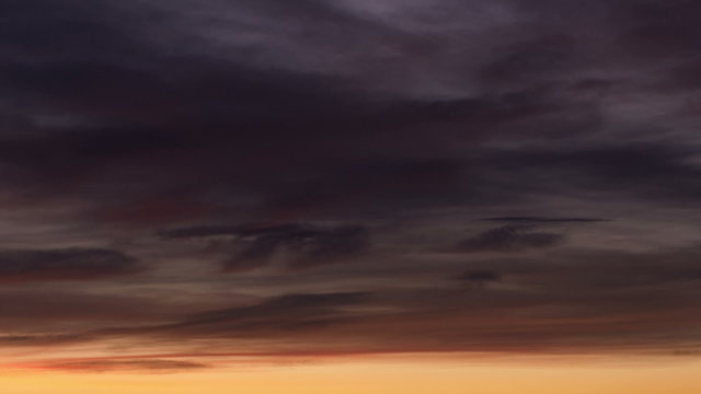 Sunset timelapse in mountains with colourful clouds