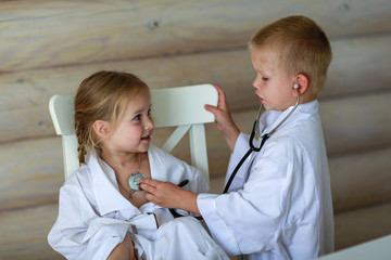 girl and boy playing doctor