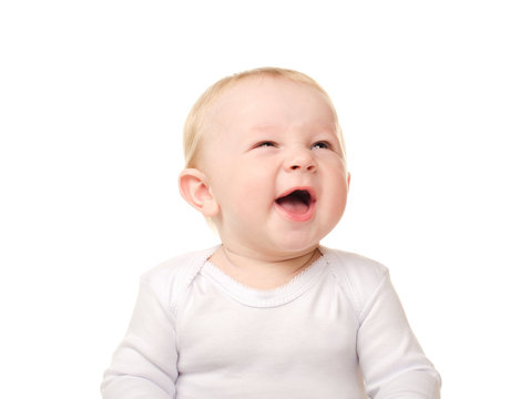 laughing funny baby boy in white