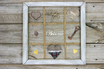 Rustic welcome sign with hearts and skeleton key