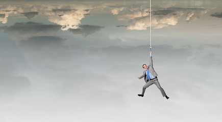 Man hang on rope © Sergey Nivens