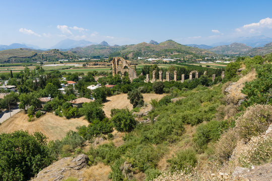 Ancient ruins of Aspendos. In the background the aqueduct. Turkey.