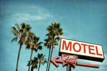 aged and worn vintage photo of motel sign palm trees - obrazy, fototapety, plakaty