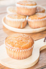 Homemade banana muffins on wooden plate