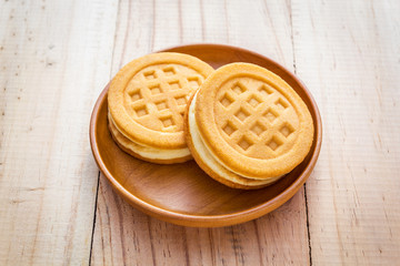 Waffles in wood dish on wood table