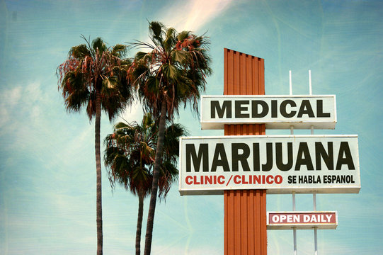 aged and worn vintage photo of medical marijuana clinic with palm trees
