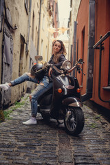 Obraz na płótnie Canvas Casual female on moto scooter