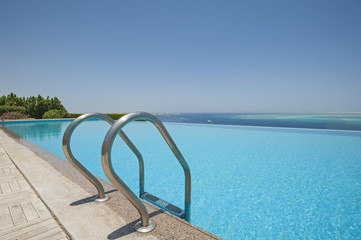 Fototapeta na wymiar Swimming pool at a luxury tropical villa