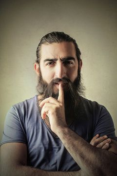 Long-bearded man thinking of something