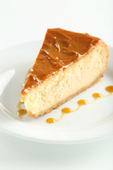 Fresh and tasty caramel cheesecake on white plate