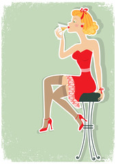 Petro woman is sitting and drinking martini in red dress
