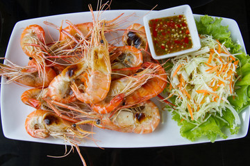 Shrimps freshwater grilled on plate  with seafood sauce.