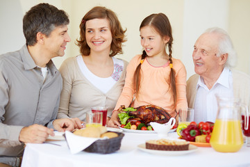 Family with roasted chicken