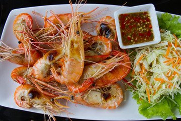 Shrimps freshwater grilled on plate  with seafood sauce.