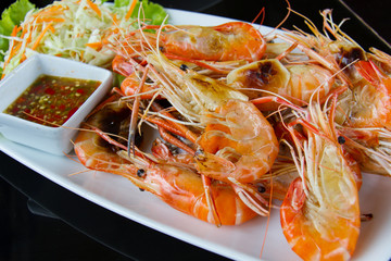 Shrimps freshwater grilled on plate  with seafood sauce.