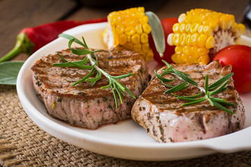 Tender and juicy veal steak medium rare with vegetables