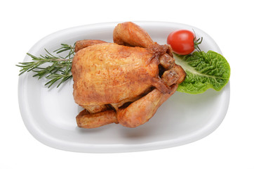 gebratenes Hähnchen auf weissen Teller 