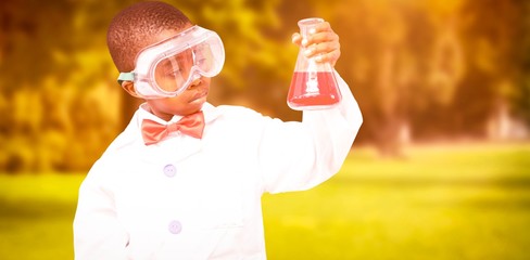 Composite image of pupil dressed up as scientist