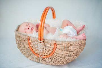 Happy newborn Baby in Basket