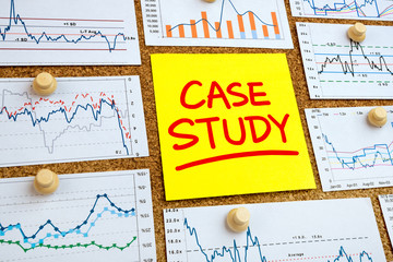 case study handwritten on post-it with financial graphs