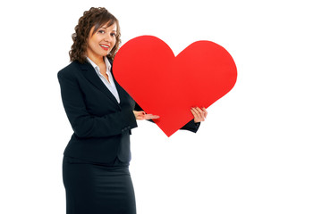 Businesswoman holding red paper heart