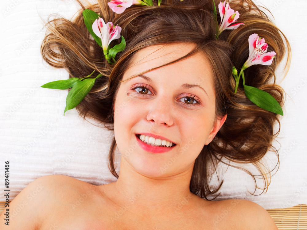 Wall mural young woman in spa studio