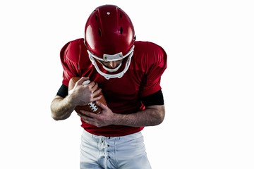 American football player protecting football