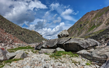 Huge granite fragments of naturally folded in a mock war machine