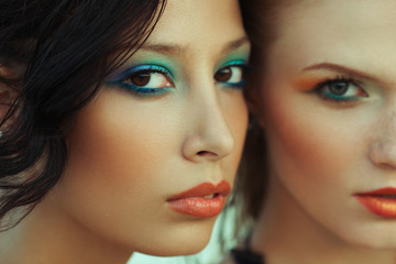 Beautiful couple of models with perfect arty make-up.
