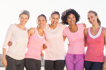 Smiling women wearing pink for breast cancer - 89414804