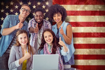 Composite image of fashion students working as a team 