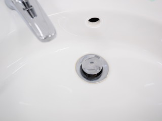 Hand wash basin drain in a pristine industrial lavatory, Melbourne, Australia 2015