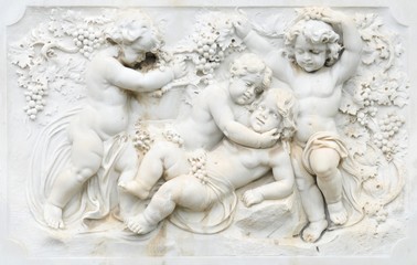 Black and white photography of basrelief with cherubs