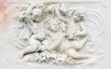 Black and white photography of basrelief with cherubs